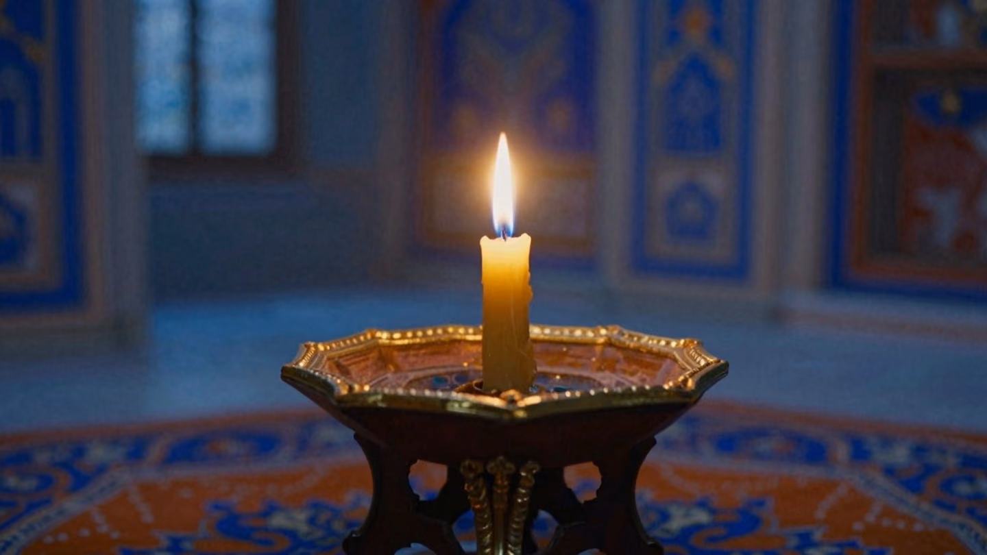 Extreme close-up of a single flickering candle flame illuminating the gold-leaf edges of a wooden prayer stand in a dim, incense-filled room during the blue hour with soft shadows.