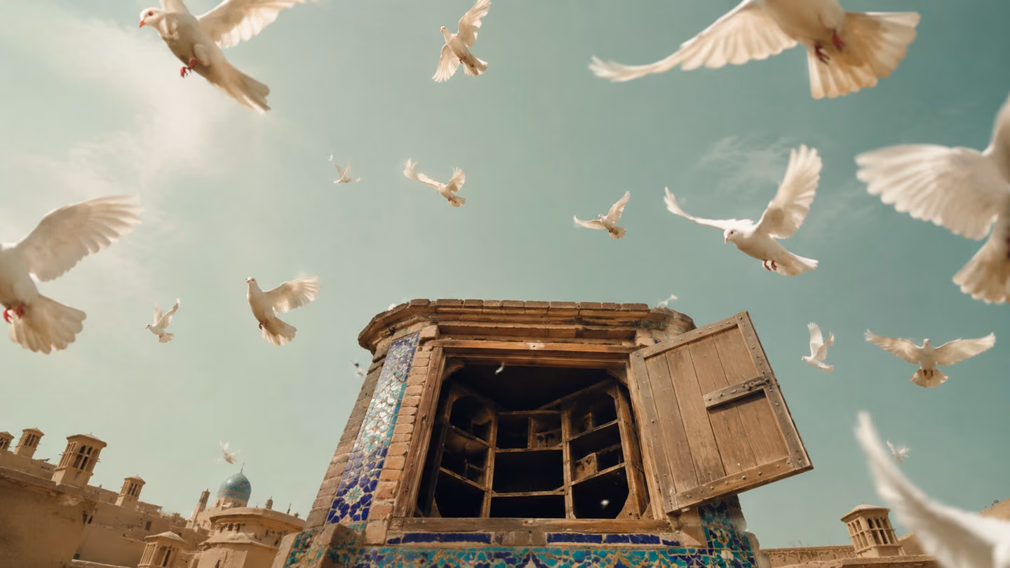 White pigeons burst upward out of an open rooftop dovecote, seen from directly below against a clear pale-green morning sky over Kashan's flat mud roofs.