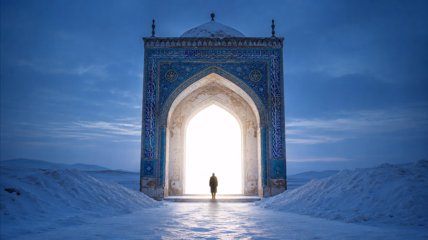 Snow banks to either side of a shrine's frontal arch standing alone on the plain, its tilework band blazing with turquoise Persian calligraphy, and beyond the opening there is nothing at all but pure white radiance.