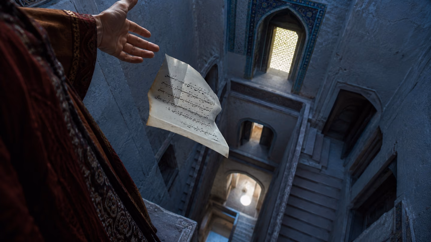A folded promise turns in the air as it falls, inked Persian lines still legible, large and near the lens.